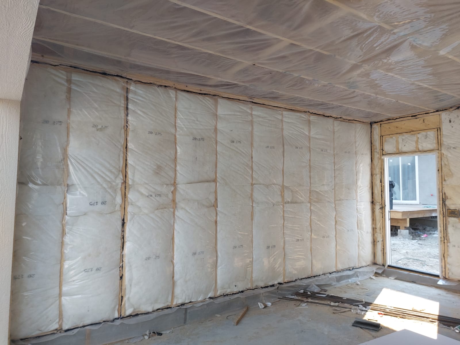 Poly vapor barrier installed on wall
